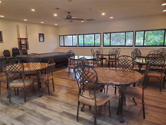 dining room featuring recessed lighting, wood finished floors, and a healthy amount of sunlight