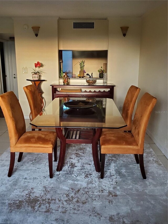 dining area featuring visible vents and tile patterned floors