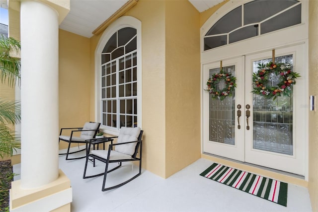 property entrance featuring french doors