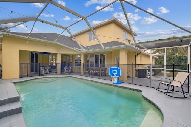 view of pool featuring a lanai and a patio