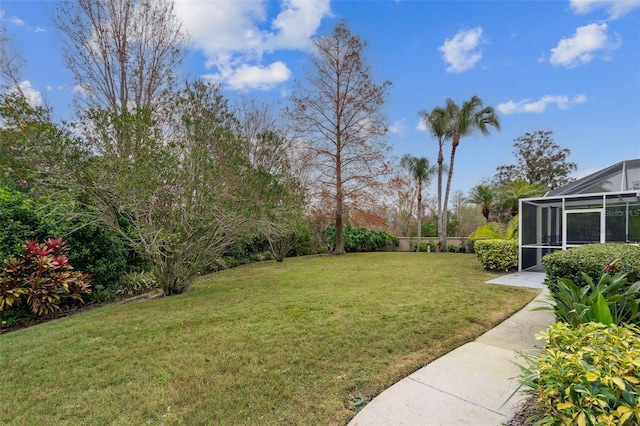 view of yard featuring a lanai