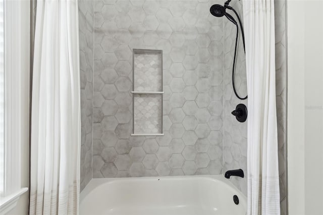 bathroom featuring shower / bathtub combination with curtain