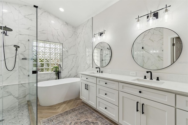 bathroom with vanity, independent shower and bath, and tile walls