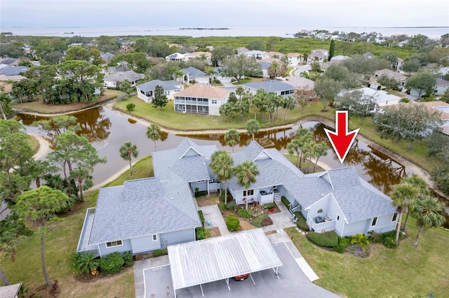 birds eye view of property featuring a water view