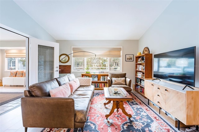 living room featuring vaulted ceiling