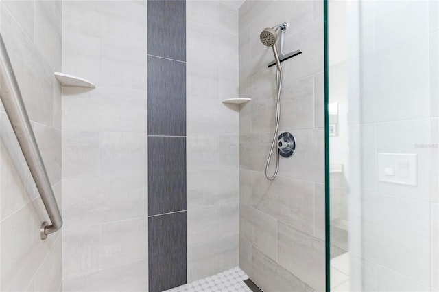 bathroom with a tile shower