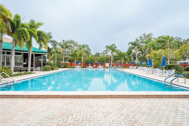 view of swimming pool with a patio area