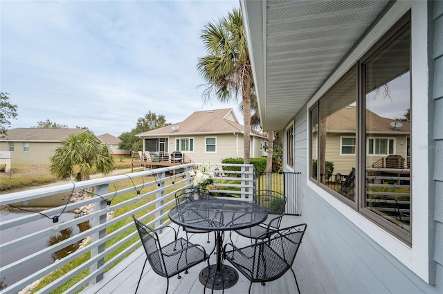1018 Caravel Ct, Tarpon Springs, FL 34689 - balcony with outdoor dining space and a residential view