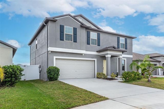 view of front of house with a garage and a front lawn