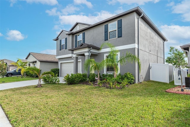 view of front of house featuring a garage and a front lawn