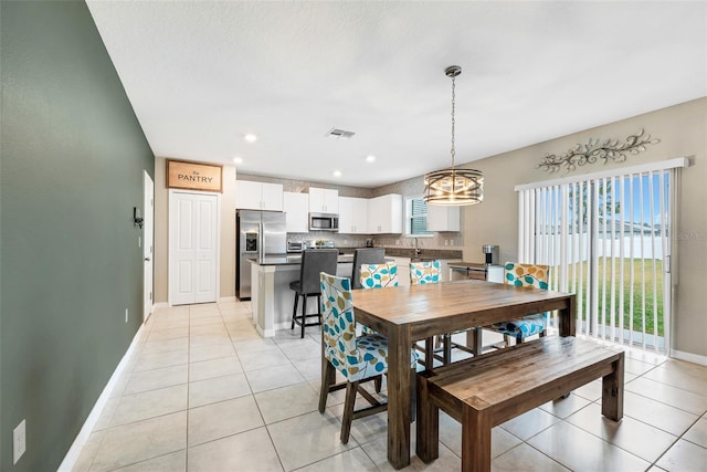 tiled dining area with sink