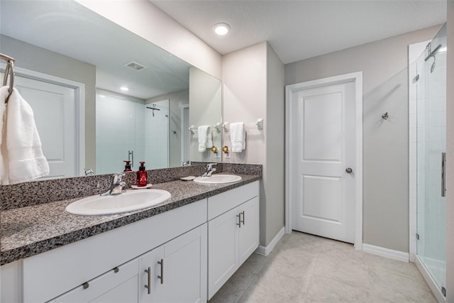 bathroom with vanity and walk in shower