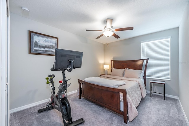 bedroom with ceiling fan and carpet flooring