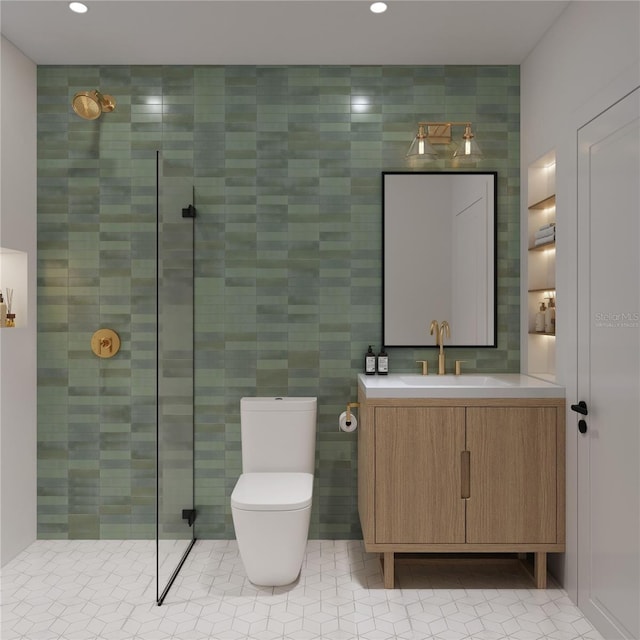 bathroom featuring toilet, tile walls, tile patterned floors, an enclosed shower, and vanity