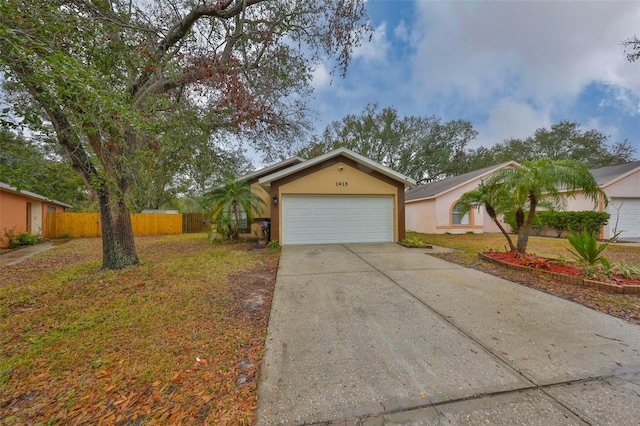 ranch-style house with a garage and a front yard