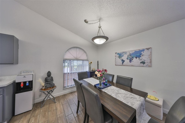 dining area with a textured ceiling