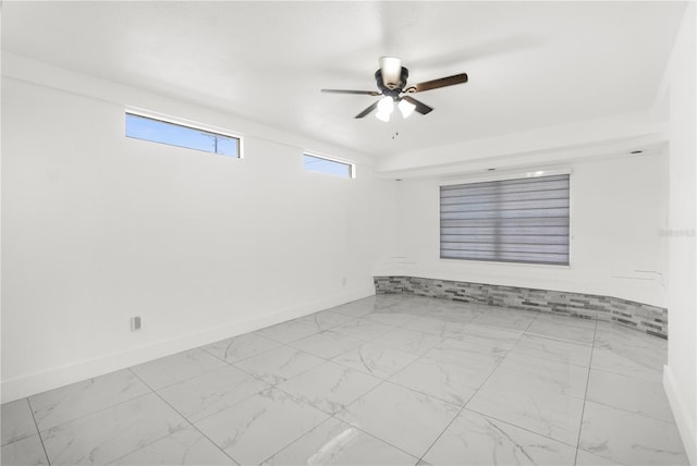 spare room featuring ceiling fan