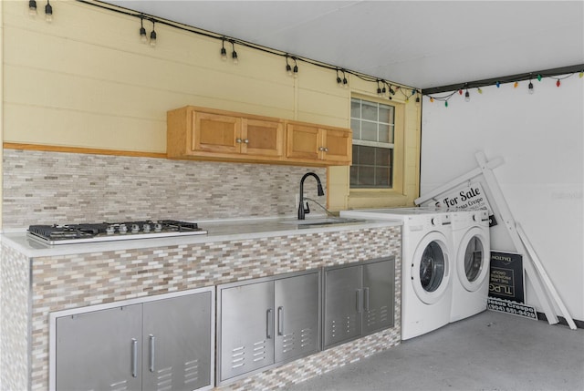 laundry room featuring cabinets and sink