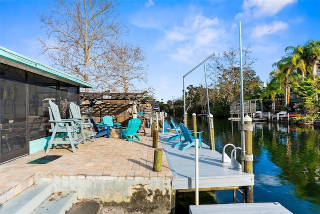 dock area featuring a water view and a pergola