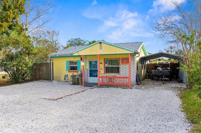 view of front of house featuring a carport and a porch