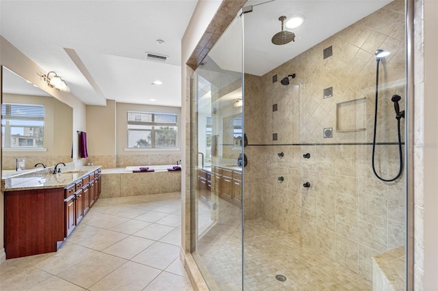 bathroom featuring a stall shower, vanity, visible vents, and tile patterned floors