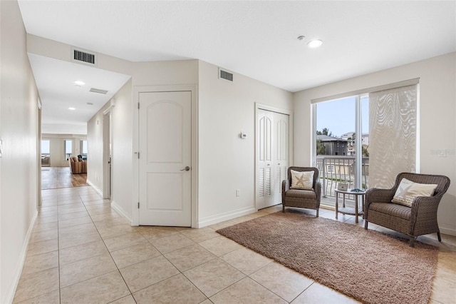 sitting room featuring recessed lighting, visible vents, baseboards, and light tile patterned floors