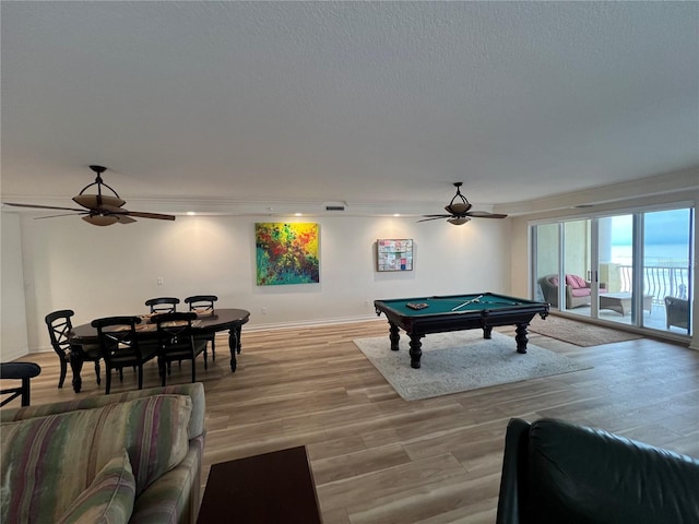 game room featuring light wood-style floors, ceiling fan, baseboards, and pool table