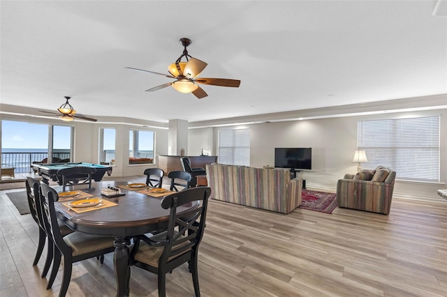 dining area featuring a ceiling fan, billiards, and light wood-style flooring