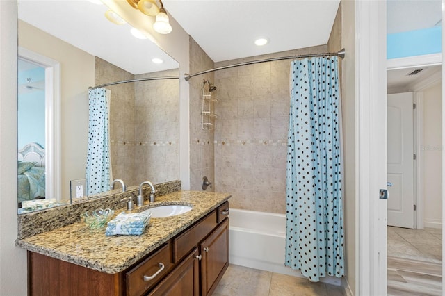 full bath with shower / tub combo, tile patterned flooring, visible vents, and vanity