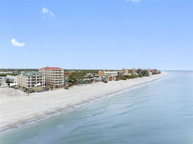 aerial view with a city view, a beach view, and a water view