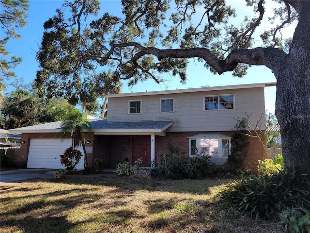 front facade featuring a garage and a front yard