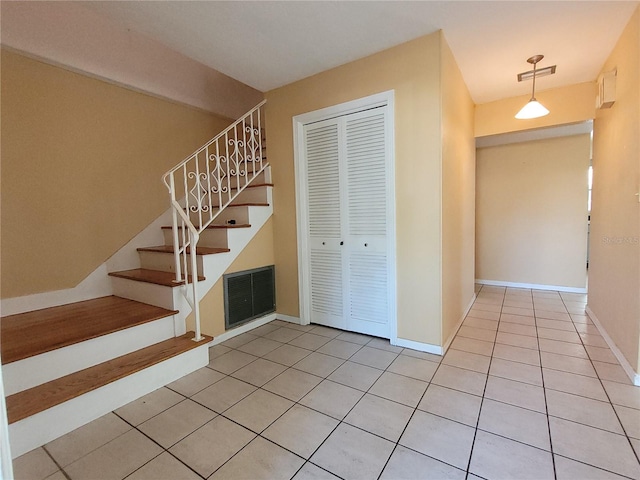 entrance foyer featuring light tile patterned floors