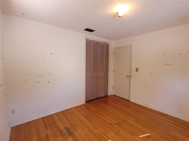 spare room featuring light wood-type flooring