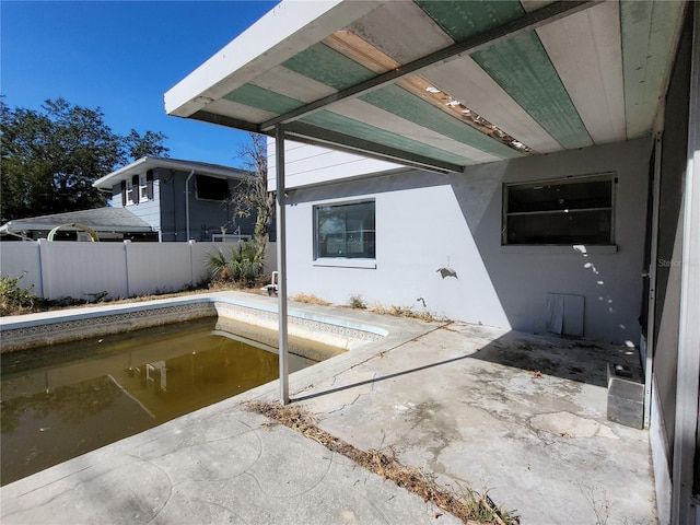 view of patio featuring an empty pool