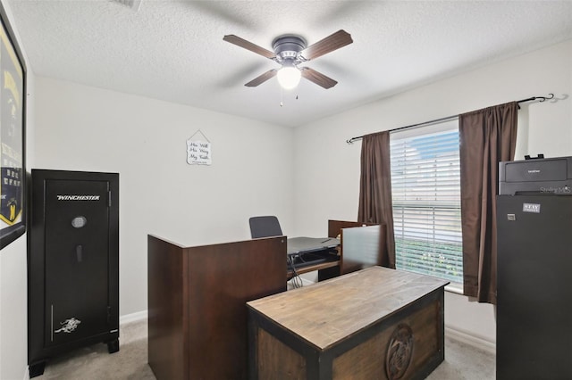 office with ceiling fan, light colored carpet, and a textured ceiling