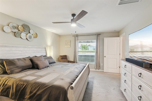 bedroom featuring ceiling fan and light colored carpet