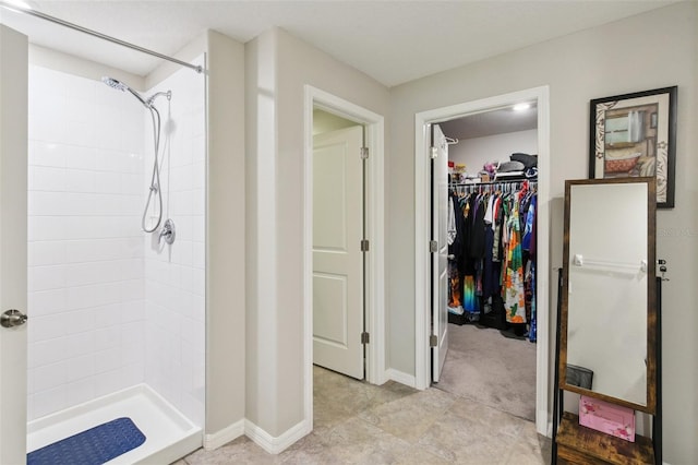 bathroom with tiled shower