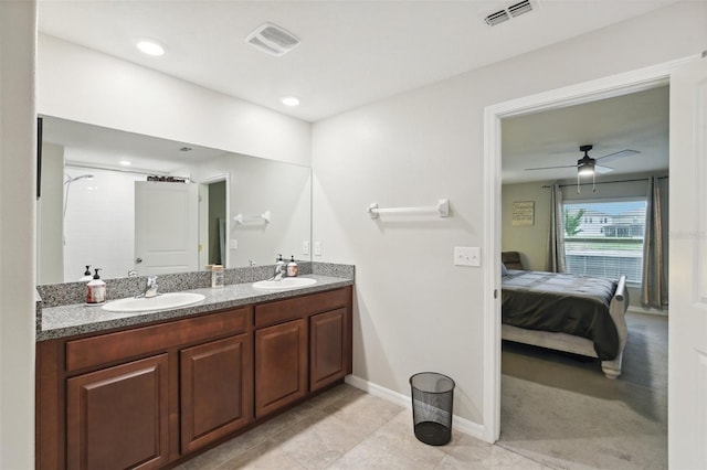 bathroom featuring ceiling fan, a shower, vanity, and tile patterned flooring