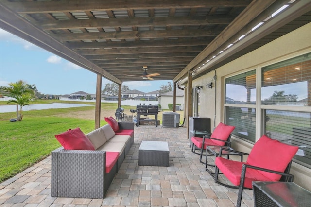 view of patio / terrace with cooling unit, an outdoor living space, and a water view