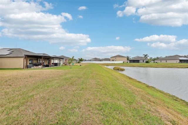 view of yard with a water view