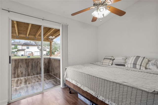 bedroom with ceiling fan, hardwood / wood-style floors, access to outside, and vaulted ceiling