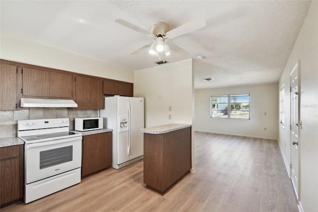 kitchen with white appliances, a textured ceiling, light wood-type flooring, and ceiling fan