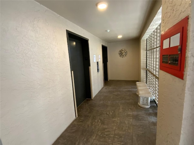 hallway featuring elevator