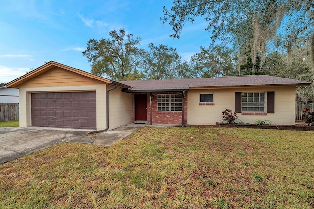 ranch-style house featuring a garage and a front yard