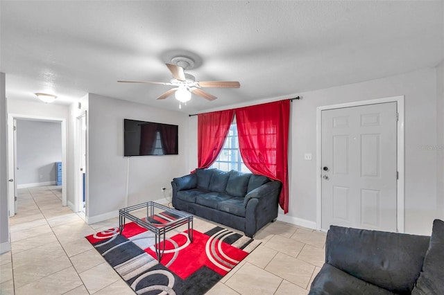 tiled living room featuring ceiling fan