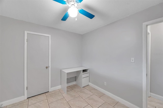 unfurnished bedroom featuring ceiling fan and light tile patterned floors