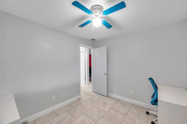 unfurnished office featuring ceiling fan