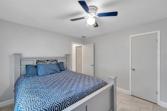 bedroom featuring ceiling fan and light tile patterned floors