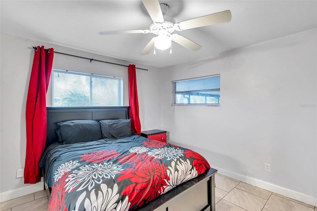 tiled bedroom with ceiling fan