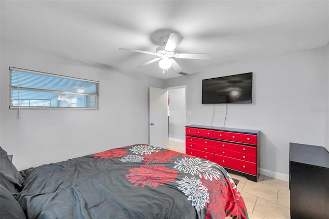 bedroom featuring light tile patterned floors and ceiling fan